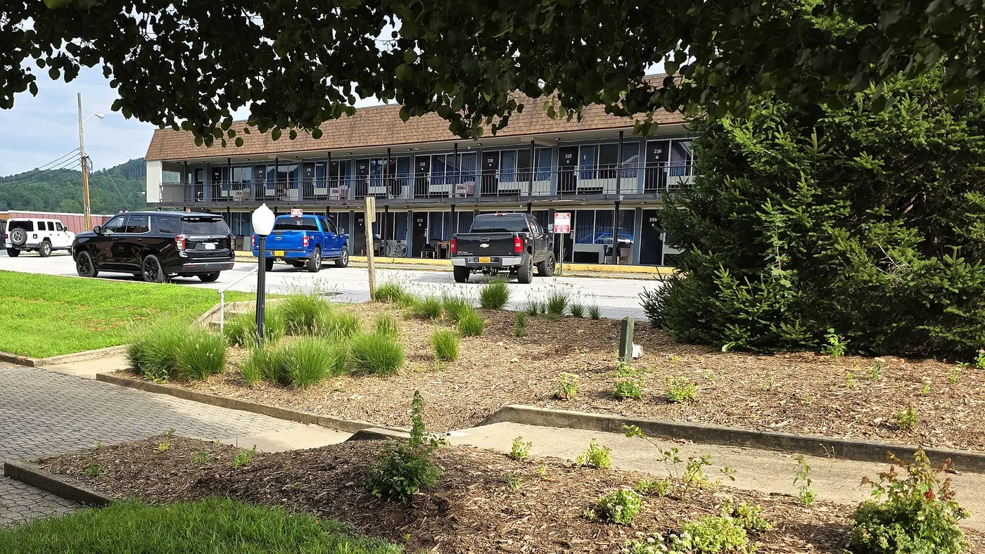 The two-story guest wing at Econo Lodge Galax with drive-up parking outside the rooms
